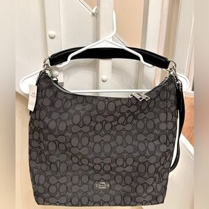 New with tag-Coach bag with short and long strap. Black with large C’s.